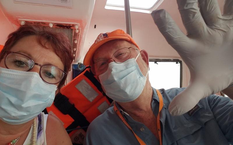 Clay County couple Susanne Treacy and Scott Farnsworth don masks while on a cruise in March. COVID-19 moved into a pandemic situation after they had been aboard for several days.