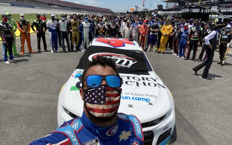 (@bubbawallace • Twitter) Bubba Wallace snaps a picture as fellow drivers and crew members show support for the Alabama native.