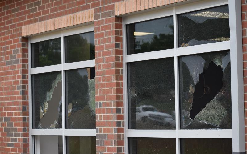 (Becky Long / Clay County Progress) Workers arrived at the Hayesville Primary School Tuesday morning to find multiple broken windows on the new Building.