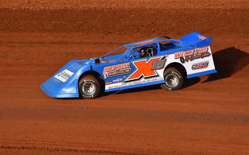 Travis Dockery • Clay County Progress The No. X15 of Shawn Chastain rips up the clay surface during practice laps. The former track champion would go on to win the Super Late Model main event to claim the Independence Day Championship.