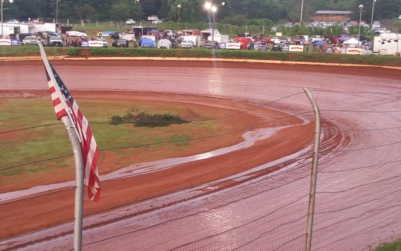 Travis Dockery • Clay County Progress A stream runs off the high banks and into the infield after a passing shower soaked the Brasstown Bullring.