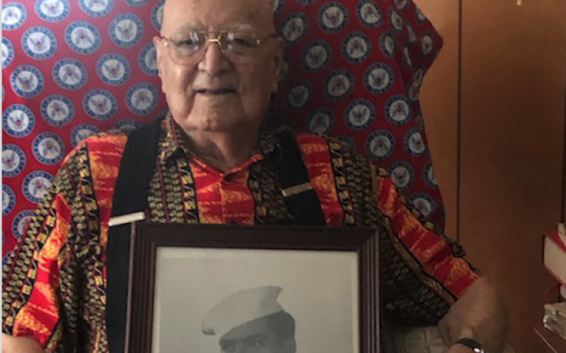 Lorrie Ross • Clay County Progress Longtime Clay County resident, Oscar Gouveia, celebrated his 95th birthday on Monday, Aug. 3. The Navy veteran told stories about being stationed in England during World War II and shared anecdotes about some of his fellow Navy men. Gouveia sits with a photo of himself in uniform, taken by a photographer he often assisted in developing film. In addition, he has his official discharge papers and letters from President Harry S. Truman and Massachusetts Governor Maurce Tobin.