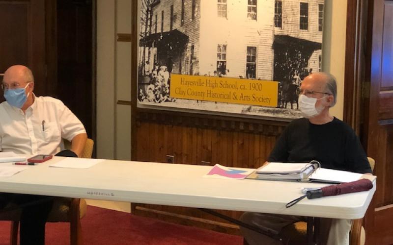 (Lorrie Ross• Clay County Progress) Mayor Harry Baughn, left, and Hayesville Town Council Chairman Joe Slaton sit several feet apart to maintain social distancing