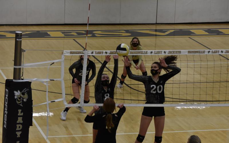 (Travis Dockery • Clay County Progress) The duo of Emma Shook, No. 8 and Hallie Johnson, No. 20 successfully block an attack attempt from a Lady Wildcat