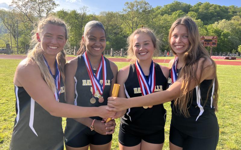 The 4x400 and 4x800 Meter Relay Team are from left, Emma Shook, Marley Espinal, Lila Roberts and Alyssa Rodd.