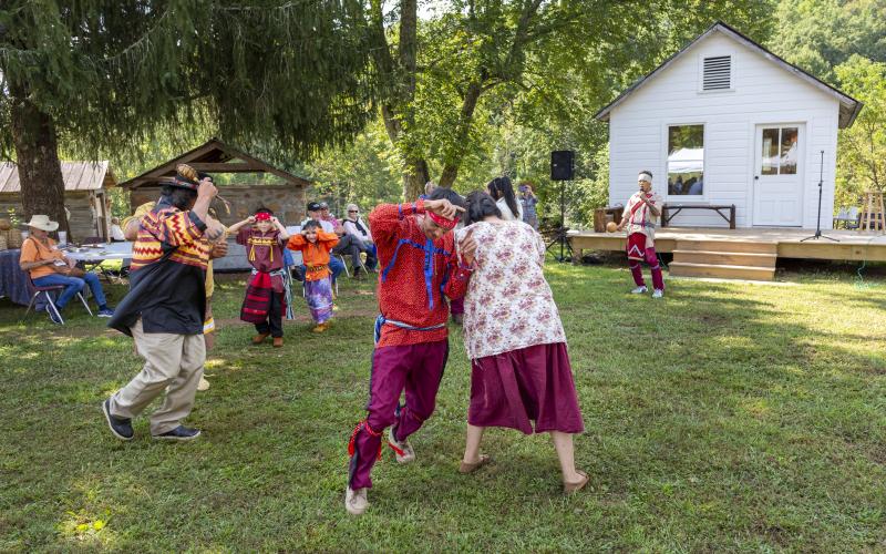 Photo • David Smart Storyteller Davy Arch entertained Cherokee Heritage Festival dancers doing a traditional Buffalo Dance at the 2022 festival. J.R. Wolfe at the right with microphone describing the dance for festival goers.