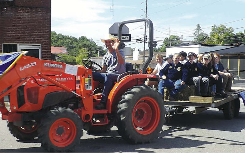 Becky Long • Clay County ProgressHayesville High School Future Farmers of America members participate in the Clay County Tractor Parade on Saturday, Sept. 24 on a tractor operated by Silas Brown. Members created a hay maze, obstacle course and entered a float. A highlight of the event was the raffle for a 1948 Ford 8N that had been restored by George Kresage of Murphy. The lucky winner was Florida resident, Maitland Dampier. Proceeds from the event go to the Dwight Smith Scholarship Fund. About 28 tractors 