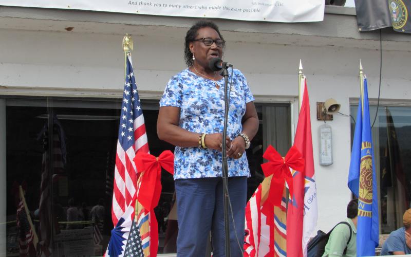 Photo by Linda Hagberg Annie Lloyd, of Hayesville, sings the national anthem and other songs at Welcome Home's fourth annual event at Western Carolina Regional Airport.