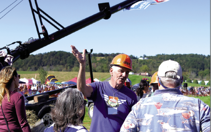 Jared Putnam • Cherokee Scout Spectators get a behind-the-scenes, up-close look at the machinery during the 2021 Punkin Chunkin Festival.