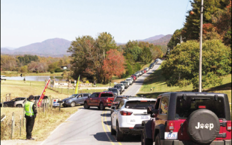 Photo • Robert Grand Cars are lined up as far as the eye can see on both sides of the Settawig Road entrance to this weekend’s Punkin Chunkin Festival site. By many accounts, this year’s crowds were among the largest in the events 13-year history. 