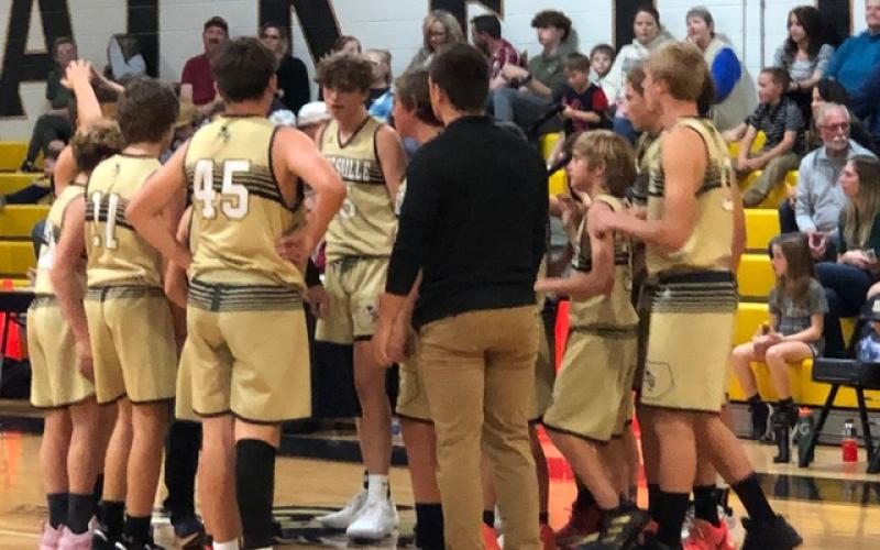 Deby Jo Ferguson • Clay County Progress Jackets get a pep talk during time out.