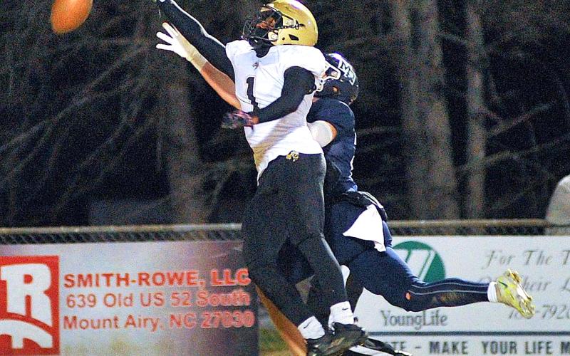 Zach Colburn • The Mount Airy News Hayesville's Asher Brown, No. 1 breaks up a pass in the first quarter of the Yellow Jackets third-round playoff game at Mount Airy.