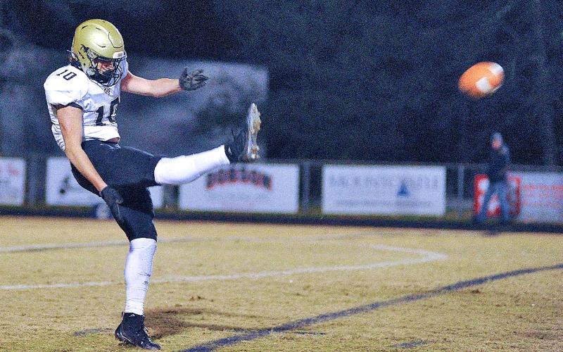 Zach Colburn • The Mount Airy News Punter extraordinaire Avery Leatherwood, No. 10, gets all of the ball on one of two Hayesville punts that went for more than 50 yards.