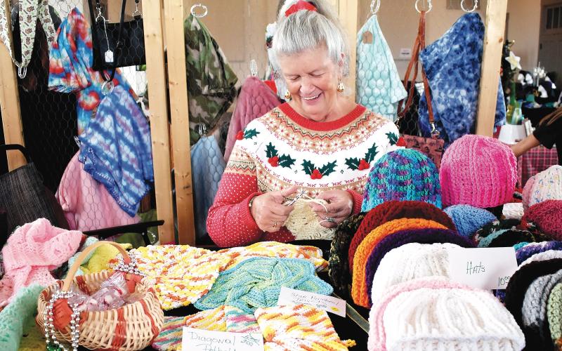 Becky Long • Clay County Progress Susie Brechbill continues to crochet items while working at her booth during the Made in the Mountains event where local vendors could sell their wares from the historic courthouse on Black Friday.