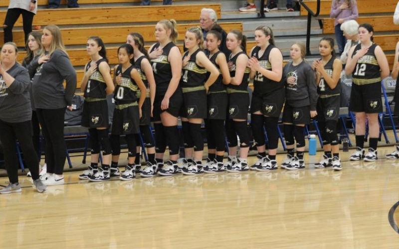 Photo by Kendra Coker Hayesville Middle School Lady Jackets shows respect during the Pledge of Allegiance.