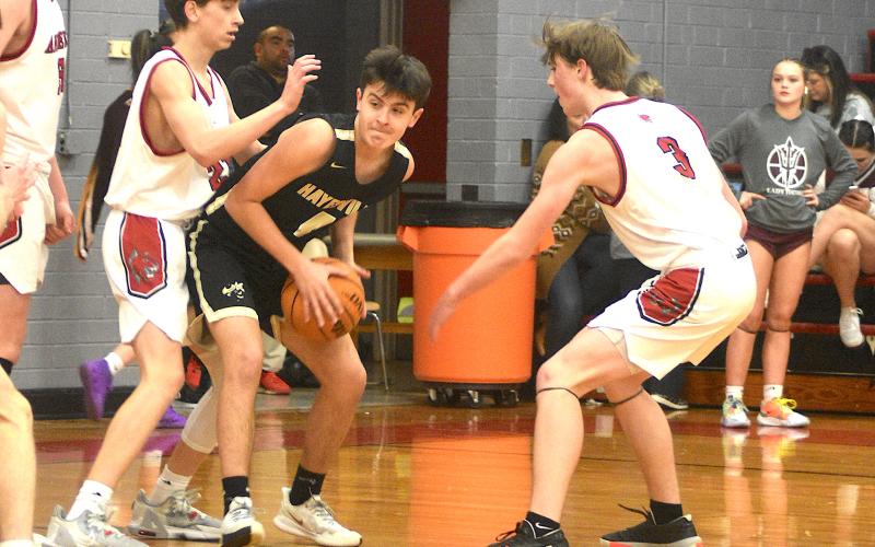 Gary Corsair• Clay County Progress Hayesville's Riley Rogers, No. 4, looks for a cutter after penetrating the heart of the Andrews defense on Monday.