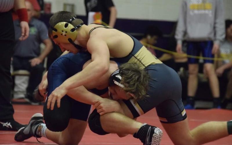 Photo by Jenny Millsaps Gage Michael in action with opponent at Regional Tournament.