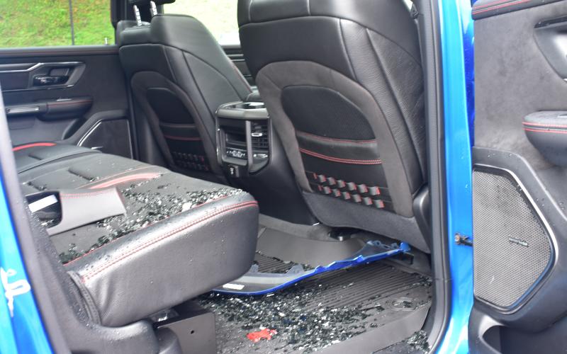 Midge Roach • Clay County Progress Glass shards fill the right back floorboard of the 2021 Ram 1500 TRX where the window was broken to gain access.