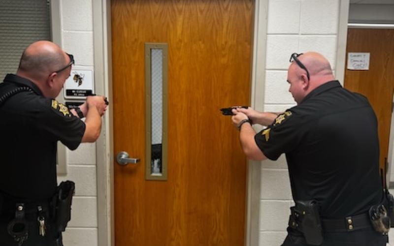 School Resource Officers Chris Harper and Donovan Byers participate in rapid deployment exercises.