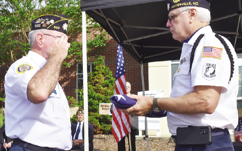 Becky Long • Clay County Progress American Legion member Mitchell Shields salutes after he and Phil Cantley conclude the flag folding ceremony during the remembrance program for the nearly 3,000 people who lost their lives 22 years ago in the 911 terrorists attacks.