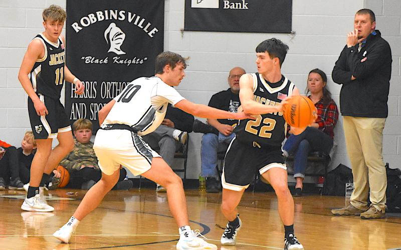 Gary Corsair • Clay County Progress Hayesville’s Jacob McClure, No. 22, looks for a cutter as Isaac Chandler, No. 11, spots up into the corner. 