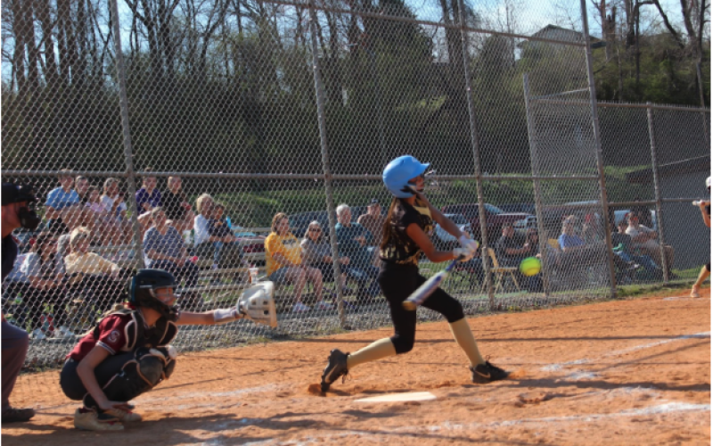 Brooke Reynolds • Clay County Progress Lucy Trout makes solid contact with the ball against Swain