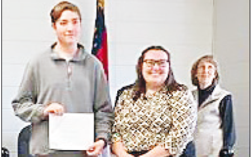 Marcia Barnes • Clay County Progress Wes Jennings was recognized by the board. He ranked No. 2 in the Western Carolina Symphonies Band Competition. Hayesville Middle School/ Hayesville High School Band Director Alexis Dockery, right, presented the award to the eighth grader.