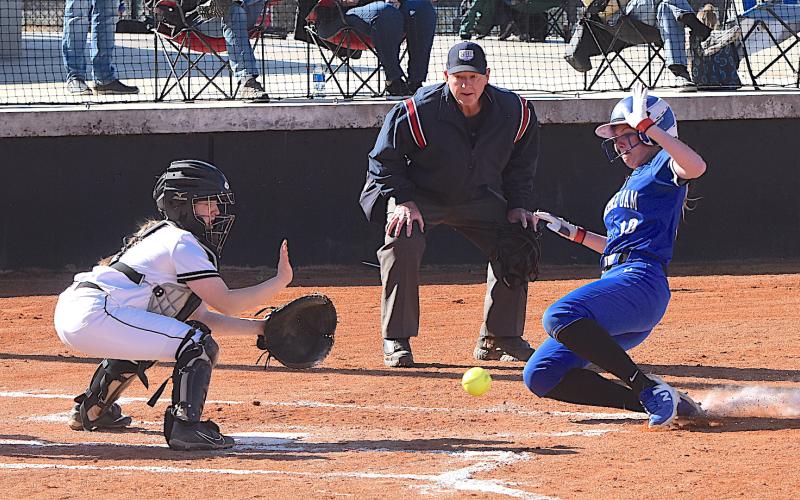 Gary Corsair • Clay County Progress Hayesville catcher Callie Long blocks the plate and reaches for the ball as a Hiwassee Dam runner attempts to score.