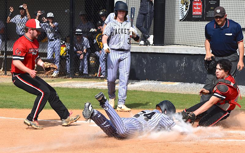 Gary Corsair • Clay County Progress Peyton McGaha slides home ahead of the tag to give Hayesville a run against Andrews on Thursday.